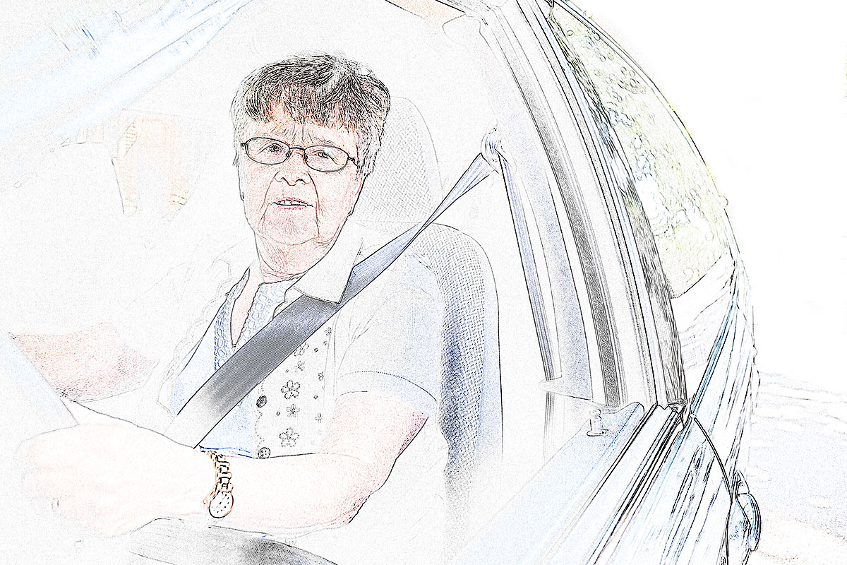 Dame au volant d'une voiture